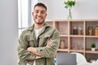 © Krakenimages.com - Young hispanic man smiling confident standing with arms crossed gesture at home