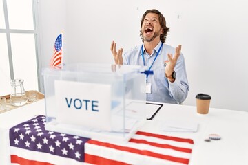 Sticker - Handsome middle age man sitting at voting stand crazy and mad shouting and yelling with aggressive expression and arms raised. frustration concept.