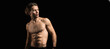 © velimir - young sexy muscular man with a naked torso on a dark background. Long-haired man sportsman.