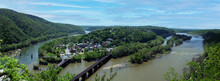 Panoramic View Of Harpers Ferry, West Virginia With River And Mountains 