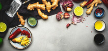 Asian Cuisine Ingredients, Food Background. Ginger, Lime, Chili Pepper, Garlic, Soy Sauce And Rice Vinegar On Gray Kitchen Table. Healthy Eating Concept. Top View Banner