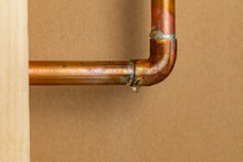 Copper Plumbing Pipe Leaking Water Inside Wall. Home Repair, Maintenance And Remodeling Concept.