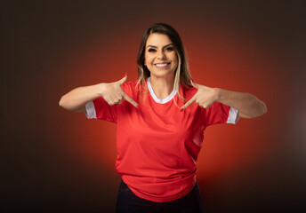 woman soccer fan cheering for her favorite club and team. world cup red background