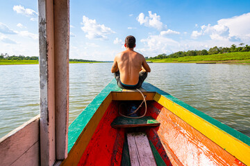 boat trip throught amazonian river in peru