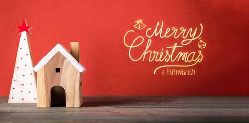 Aufkleber - Merry chistmas and happy new year with wooden home wear santa hat on wood table with vivid red background