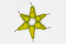 Star Of David Made From Pears On White Background. Ripe Pears Laid Out In The Shape Of An Eight-pointed Star Of David - A Symbol Of Jewish Identity Judaism.  Sweet And Juicy Pears. Close-up. Top View