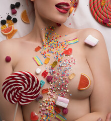 Wall Mural - Nude blonde body covered with sweets and caramel