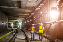 Soft Focus And Blurred Lighting Background Of Focus At Engineer Or Technician Control. Underground Tunnel Infrastructure. Transport Pipeline By Tunnel Boring Machine For Electric Train Subway