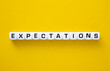 Expectations word on yellow background. Evaluation Concept