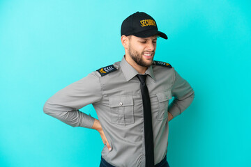 Wall Mural - Young security man isolated on blue background suffering from backache for having made an effort