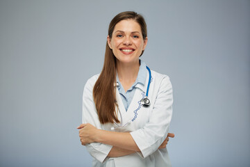 Wall Mural - Smiling doctor woman in medical uniform. Isolated portrait of female medical worker.