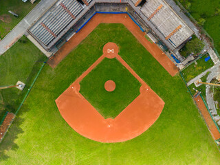 Drone Aerial View flying above a outdoor Baseball Field Diamond.