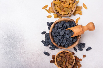 Canvas Print - Wooden bowls with raisins as ingredient for tasty dessert