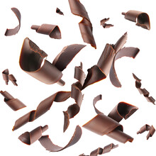 Many falling chocolate curls on white background
