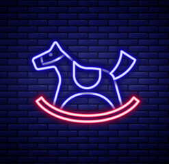 Poster - Glowing neon line Wooden horse in saddle swing for little children icon isolated on brick wall background. Colorful outline concept. Vector