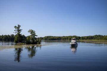 Wall Mural - A pleasure boat on the Rideau Canal in Ontario, Canada on a summer day