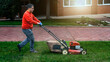 © Floren Horcajo - Gardener operating the lawn mower