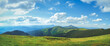 © Anastasia Pro - Amazing alps panorama green meadow and mountain range. Blue sky and clouds in sunny day. Beautiful natural summer scenery. Alpine highlands nature landscape. Travel adventure concept image. Copy space