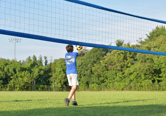 Wall Mural - Volleyball player setting the ball outdoors