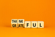 Thankful And Grateful Symbol. Concept Words Thankful And Grateful On Wooden Cubes. Beautiful Orange Table Orange Background. Business Thankful And Grateful Concept. Copy Space.