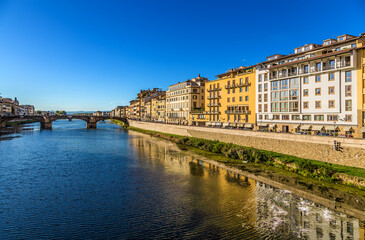Wall Mural - florence, italy. picturesque view of the embankment of the river arno and the bridge of santa trinit