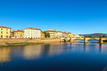 Wall Mural - florence, italy. embankment of the arno river and the ponte alle grazie bridge