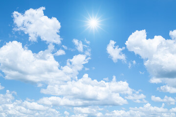 Wall Mural - white clouds and sun with sunlight on blue sky.