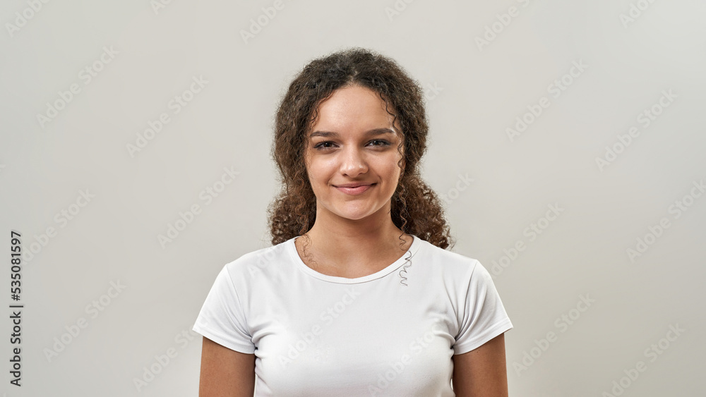 Portrait of smiling teenage girl looking at camera Stock Photo | Adobe ...