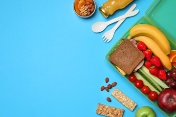 Wall Mural - Flat lay composition with tasty food and cutlery on light blue background, space for text. School dinner