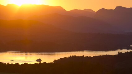 Wall Mural - View of sunset over Windermere in Lake District, a region and national park in Cumbria in northwest England, UK.