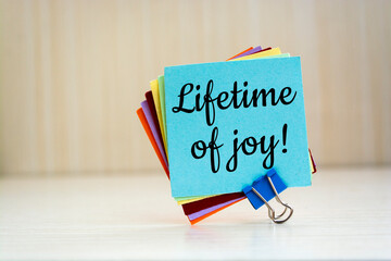 Wall Mural - Lifetime of joy written on a memo at the office