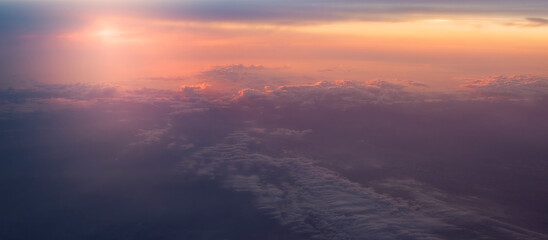 Wall Mural - dramatic sunset panorama from above the clouds