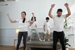 © tigercat_lpg - Happy wellness Asian Thai family, parents, and children are fun playing hula hoops together, fitness training and healthy exercise in white living room, domestic home lifestyle, and weekend activity.
