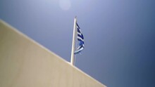 Greek Flag Waving With Blue Sky Background