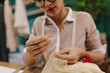 © Jacob Lund - Woman hands doing handwork on dress