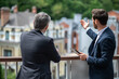 © zinkevych - Two businessmen negotioating regarding new property and looking interested