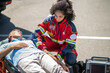 © zinkevych - EMT strapping the patient to the stretcher
