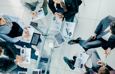 Wall Mural - top view. business colleagues sitting at the office Desk.