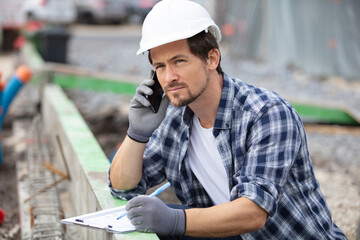 construction worker on the phone outdoors