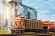 © graja - Loading railway carriages at grain elevator