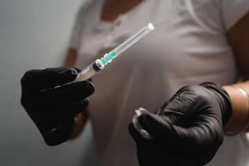 A close up of hands and blood draw process