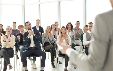 image of a speaker giving a lecture at a business seminar