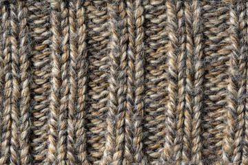Wall Mural - Knit fabric texture or background . Textile, scarf or sweater textured surface. Warm accessories, clothing, fashion concept. Closeup view