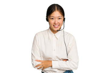 Wall Mural - Telemarketer asian woman working with a headset isolated on green chroma background laughing and having fun.