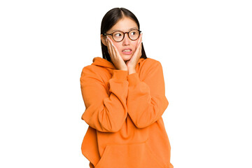 Wall Mural - Young Asian woman isolated on green chroma background scared and afraid.