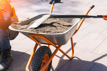 Construction Wheelbarrow With Sand And Shovel