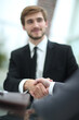 © ASDF - close up. business partners, confirming their agreement with a handshake.