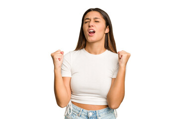 Wall Mural - Young Indian woman isolated cutout removal background raising fist after a victory, winner concept.