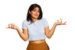 © Asier - Young Indian woman isolated on green chroma background doubting and shrugging shoulders in questioning gesture.