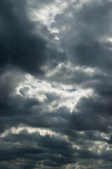 Wall Mural - Dark and dramatic storm clouds on the sky